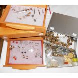 A polished wood jewellery chest and a metal drawer unit containing costume jewellery, cuff-links,