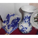 A reproduction transfer printed blue and white cheese dish and a modern blue and white crackle glaze