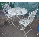A cast and wrought metal garden table and two chairs