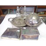A silver plated roll-top breakfast dish, two bottle stand, tray, dish, and two cigarette boxes, on