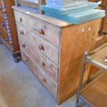 A 3' 8" antique stripped pine chest of two short and three long graduated drawers, set on bracket