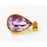 A marked 18k yellow metal pendant, set with large pear drop cut deep faceted amethyst, with