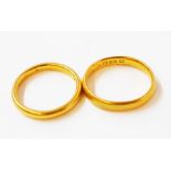 Two hallmarked 22ct. gold wedding bands - 8.1grms