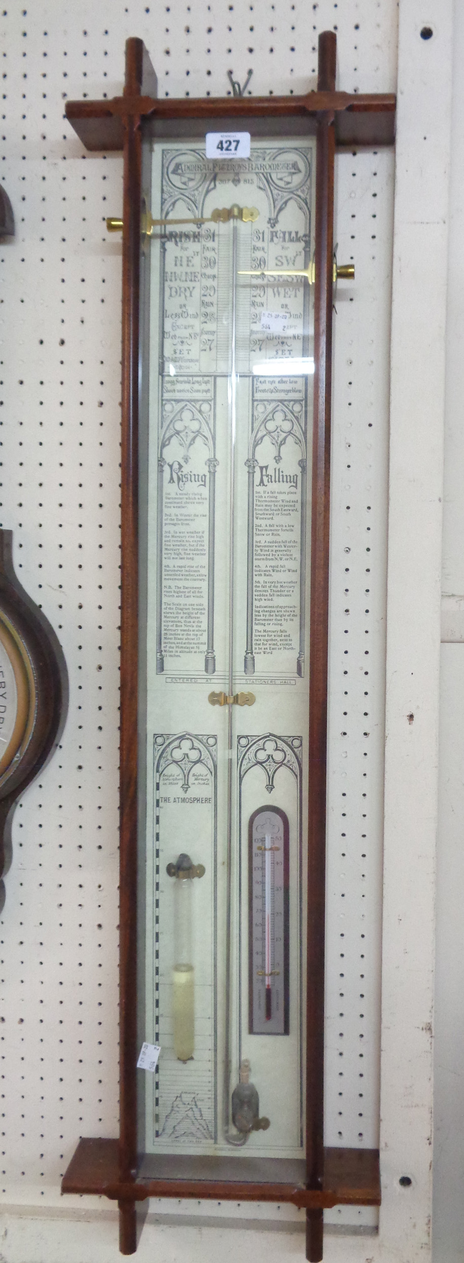 A reproduction stained oak Gothic style cased Admiral Fitzroy barometer with printed backboard,