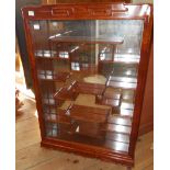 A 20" Chinese polished hardwood wall mounted display cabinet with mirror back and an array of