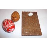 A Chinese carved wood card case, a coquilla nut potpourri, and a painted wooden egg