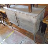 A 3' 6" 20th Century shabby chic two door cabinet, set on square tapered and fluted legs