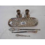 A 9" silver oval dressing table tray with embossed decoration (Birmingham 1935) - containing a