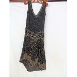 A 1920's black flapper dress with black and silver beadwork