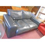 A 7' 10" late 20th Century stitched leather upholstered two seater settee with wide rounded armrests