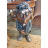 A carved and part painted wooden caricature statue Serge Gainsborough