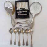 A small collection of antique and later teaspoons and pair of sugar tongs - sold with a silver-