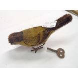 A vintage Schuco clockwork toy bird - working