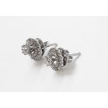 A pair of unmarked high carat white metal metamorphic diamond encrusted ear-rings, convertable