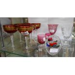 A set of six 20th Century Venetian ruby and gilt champagne glasses, two cranberry custard cups,