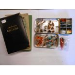 Two cases containing sea trout and salmon fishing flies - sold with three fishing books