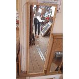 A parcel gilt framed full length dressing wall mirror with narrow oblong plate