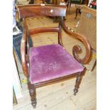 A 19th century mahogany framed open scroll elbow chair with upholstered drop-in seat, set on