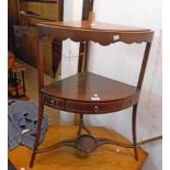 A 22" 19th Century mahogany and strung corner washstand with shaped apron drawer to middle tier