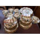 A quantity of Coalport Indian Tree pattern bone china teaware comprising fourteen trios, milk and