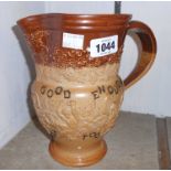 A Royal Doulton Bacchanalian salt glazed stoneware jug with "Good is not Good Enough.. Best is not
