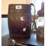 An old coopered costrel barrel with leather hanging straps