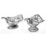 A pair of 7 1/2" Goldsmiths & Silversmiths, Co., Ltd. silver bon bon dishes with ornate cast rims,