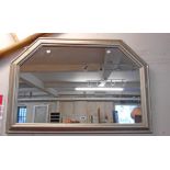 A 3' 2" silvered gilt framed wall mirror with canted top