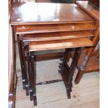 A Quartetto set of rosewood quarter veneer topped tea tables, set on slender turned supports splayed