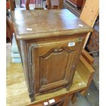 A 16" old French oak pot cupboard with decorative moulded panel door, set on cabriole legs - sold