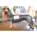 A cast metal daschound doorstop A modern cast metal dachshund doorstop