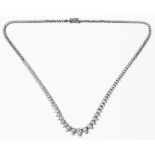 A marked 750 white metal necklace, the lower links eack set with paired round brilliant cut