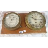 A 7 1/4" diameter brass cased aneroid bulkhead barometer by Pascall Atkey & Son., Cowes with