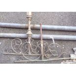 A large brass rod screen hanging pole with decorative finials