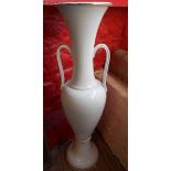 A large white ceramic floor vase with gilt highlighting