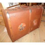 A vintage wood bound and weather coated Dura suitcase