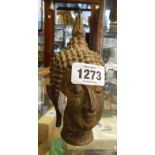 An old Thai Buddha head with remains of gilt finish