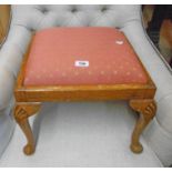 An early 20th Century stained beech grained stool with a later upholstered drop-in seat, set on