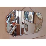 An Art Deco frameless wall mirror with bevelled octagonal plate and chrome plated clasps