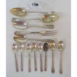 Two antique silver spoons with parcel gilt bowls - sold with other small silver cutlery items -
