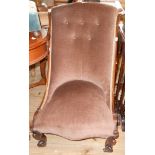 A 19th Century rosewood framed swept back nursing chair with brown button back velour upholstery,