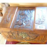 A small oriental carved camphor wood box