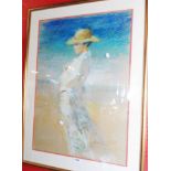 A gilt framed pastel drawing, depicting a woman wearing a hat on a beach - indistinctly signed -