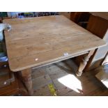 A 3' 6" Victorian pine farmhouse kitchen table with eight plank top and small frieze drawer, set