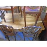 A 4' 3" old waxed pine farmhouse kitchen table with triple plank top, set on turned legs