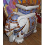 A modern ceramic elephant form garden seat