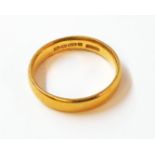 A hallmarked 22ct. gold wedding band - 5.6grms