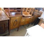 A 6' early 20th Century walnut break-top sideboard with decorative applied moulding to flanking