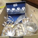 A pair of silver plated small pedestal bowls, pair of toast racks, cased toilet bottles and a silver