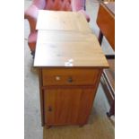 A pair of 15 1/4" modern pine bedside cabinets, each with drawer and moulded door under